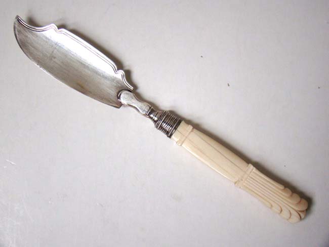 An 18th century English Sterling Silver Master Butter Knife with Ivory handle.